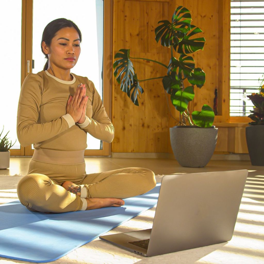 1:1 session at home with the laptop on a yoga mat