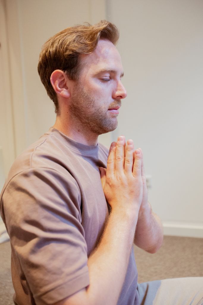 Hands to heart breathing practice